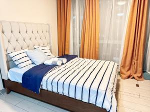 Una cama o camas en una habitación de BGC Luxe Stay Facing Uptown Mall & Grand Hyatt