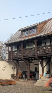 a large wooden house with a deck on top at Les Perles du Ried - Gîte 8 - 15mn Europapark - proche Strasbourg Colmar in Boofzheim +25 photos