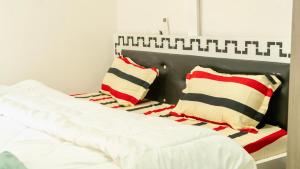 Ένα ή περισσότερα κρεβάτια σε δωμάτιο στο Lagoon Suites