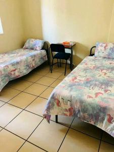 Postel nebo postele na pokoji v ubytování Elimu house