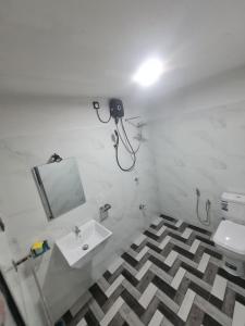 a bathroom with a sink and a mirror and a toilet at Frida Cove in Weligama +15 photos