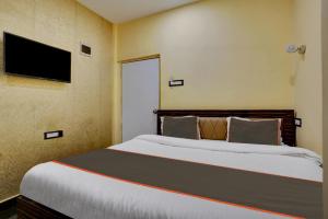 Ένα ή περισσότερα κρεβάτια σε δωμάτιο στο Super Hotel O Golden Suites +32 φωτογραφίες