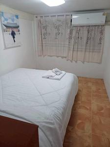 Ένα ή περισσότερα κρεβάτια σε δωμάτιο στο Smile Home