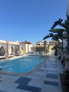 a swimming pool on top of a building at The D9 Luxury Suites - Hurghada in Hurghada