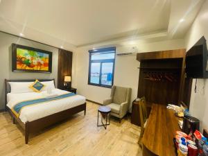 Ένα ή περισσότερα κρεβάτια σε δωμάτιο στο King Sea Hotel