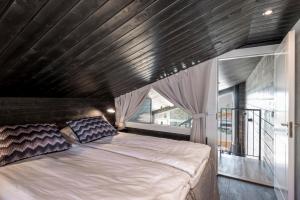 Postel nebo postele na pokoji v ubytování Ski-inn Pyhälinna Deluxe Villas