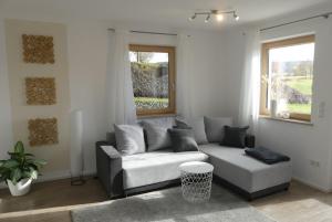 a living room with a couch and a window at Apartment in Stetten bei Mindelheim in Stetten