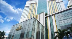 a large building with a sign on the side of it at Summit Hotel Subang USJ in Subang Jaya