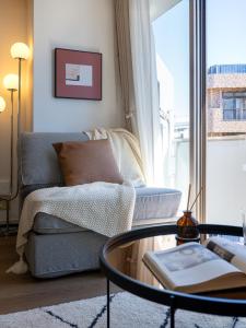 a living room with a couch and a glass table at RARE-EBISU BREEZE Apartment in Tokyo