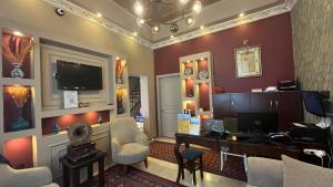 an office with a desk and a tv on a wall at Hotel Tulip House in Istanbul +111 photos