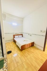 Giường trong phòng chung tại Thuận Phát Motel Bình Dương