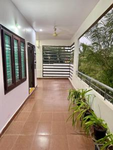 a balcony of a house with plants on it at Vididhi By N - 2BHK Neo Stay in Kottapeta
