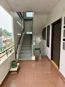 a hallway of a building with stairs and a stair case at Vididhi By N - 2BHK Neo Stay in Kottapeta