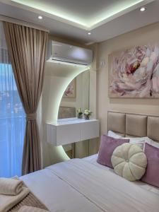 Ένα ή περισσότερα κρεβάτια σε δωμάτιο στο Apartman NIKOLINA