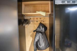 a kitchen with a trash bag hanging from a refrigerator at Ski-inn Parkside in Ruka