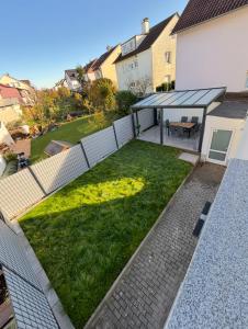 an overhead view of a backyard with a grassy yard at Nisay Home - Apart Hotel - 3 Room Apartment - N3 in Ludwigsburg