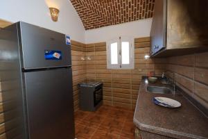 Kuchyň nebo kuchyňský kout v ubytování Beit Al Madina + 47 fotografií