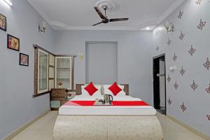 Postel nebo postele na pokoji v ubytování Hotel O BlackBull