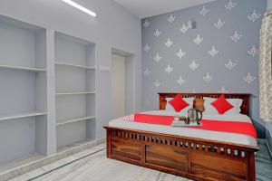 Postel nebo postele na pokoji v ubytování Hotel O BlackBull