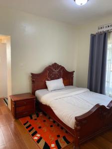 Ένα ή περισσότερα κρεβάτια σε δωμάτιο στο Kira