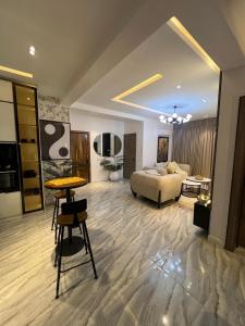 a living room with a couch and a table at Urban Muse in Lekki