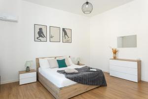 Postel nebo postele na pokoji v ubytování Casa Levante - Near the station and city center