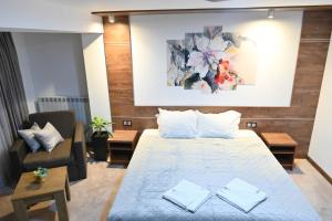 Ένα ή περισσότερα κρεβάτια σε δωμάτιο στο Hotel Rothmans-Breakfast - Free parking - Lobby