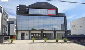 a building with a red sign on the front of it at Flat 403 - Central - Edifício Home Business in Pomerode +3 photos
