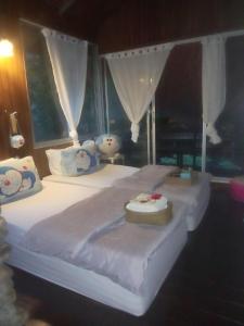 En eller flere senge i et værelse på เฌอPrime Cher Prime by Tree house Maelai