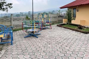 a group of playground equipment on a patio at Urbanview Hotel Nerine's Glamping Village Cipanas by RedDoorz in Barukupa