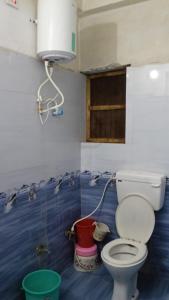 Koupelna v ubytování Mahadev Guest House