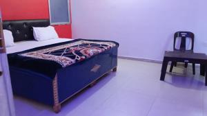 Postel nebo postele na pokoji v ubytování Mahadev Guest House