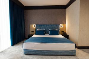 Ένα ή περισσότερα κρεβάτια σε δωμάτιο στο Ganja Sport Palace +29 φωτογραφίες