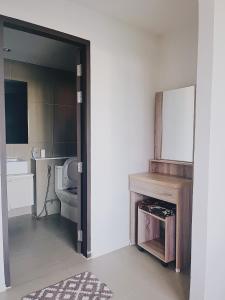 a bathroom with a toilet and a mirror at 02Nice room phuket town near Shopping Malls and Naka night market in Phuket Town
