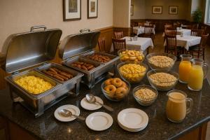 a buffet of food on a table in a restaurant at Shivalaya Retreat - A River Side Resort in Manāli