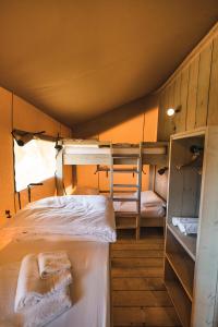 Postel nebo postele na pokoji v ubytování Glamping Le Tegole