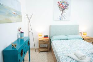 Postel nebo postele na pokoji v ubytování APARTAMENTO LOS BATELES - Frente a la playa