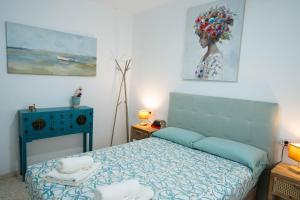 Postel nebo postele na pokoji v ubytování APARTAMENTO LOS BATELES - Frente a la playa