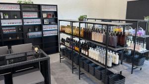 a wine store with shelves of wine bottles at ホテルテラス小名浜 in Iwaki
