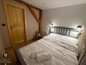 Giường trong phòng chung tại Apartamenty For You +4 ảnh