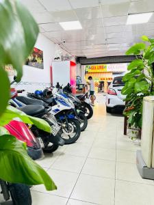 a row of motorcycles parked in a garage at Thanh Long Hotel Hồ Chí Minh in Ho Chi Minh City