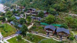 an aerial view of a house on a hill at Granny's Den BY ELIVAAS in Dhanaulti +28 photos
