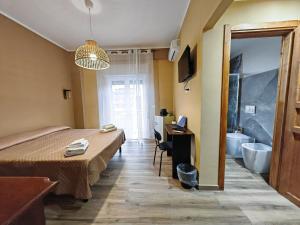 TV a/nebo společenská místnost v ubytování B&B Amàre