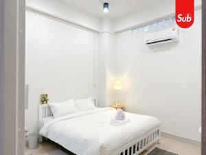 En eller flere senge i et værelse på Smart Luxury House in Hat Yai