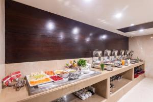 a buffet in a hotel with many different foods at Siddhartha Diyalo in Bīrganj