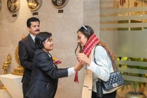 a woman is shaking hands with a man at Siddhartha Diyalo in Bīrganj