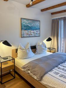 Postel nebo postele na pokoji v ubytování swissme - modernes Studio am Sportplatz mit Balkon & Parkplatz