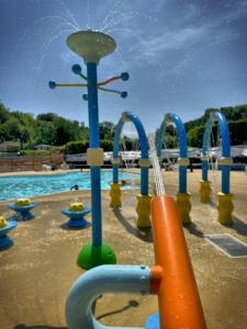 a playground with a water park with a pool at Domaine du Blanc Pignon in La Calotterie