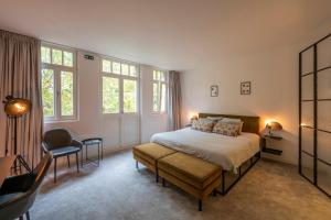 Ένα ή περισσότερα κρεβάτια σε δωμάτιο στο B&B Achilles