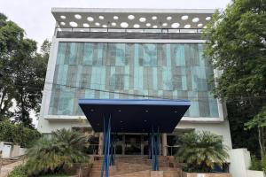 a building with a blue structure in front of it at City Falls Iguazú in Puerto Iguazú